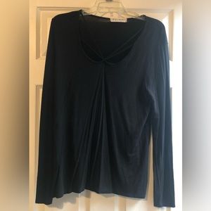 Black shirt, cross string detail at neckline